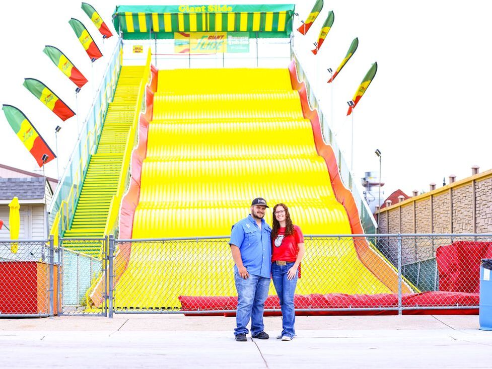 Couple in front of big slide