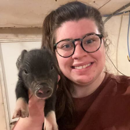 Girl Holding Pig